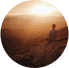 Person sitting on a hilltop at sunset, reflecting naturalness